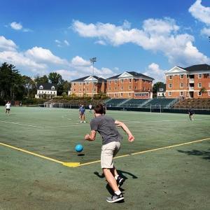 Students playing kickball